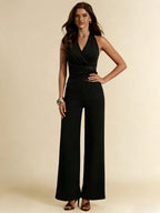 Damen Schwarzer sexy Neckholder-Jumpsuit Ärmelloser V-Ausschnitt Spitzen-Panel Tailliert Weiter Bein Romper Mode Frühling Sommer Party Jumpsuit