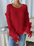 Modischer Strickpullover mit Schleifendetails, durchbrochenen Raglanärmeln und Rundhalsausschnitt im minimalistischen Stil