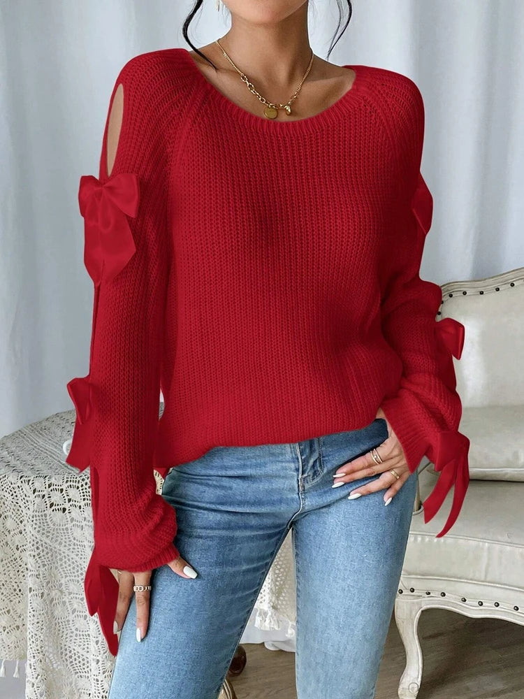 Modischer Strickpullover mit Schleifendetails, durchbrochenen Raglanärmeln und Rundhalsausschnitt im minimalistischen Stil