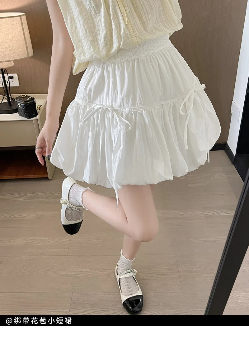 Süße Schleifen Plissierte Flauschige Röcke für Damen Sommer Koreanischer Stil Elastische Taille Laternenrock Damen Lockerer Weißer A-Linien Minirock