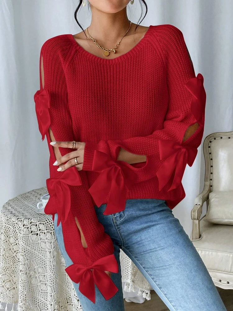 Modischer Strickpullover mit Schleifendetails, durchbrochenen Raglanärmeln und Rundhalsausschnitt im minimalistischen Stil