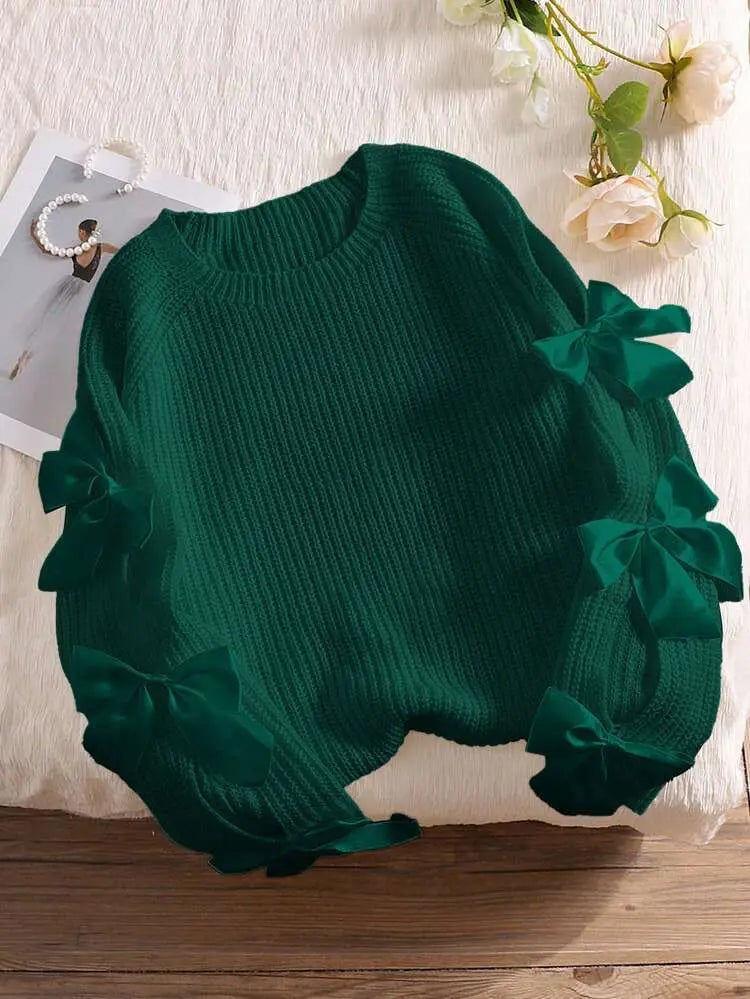 Modischer Strickpullover mit Schleifendetails, durchbrochenen Raglanärmeln und Rundhalsausschnitt im minimalistischen Stil